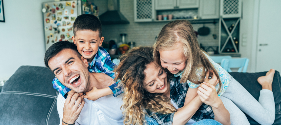 Happy family who has all of their question answered about their estate plan