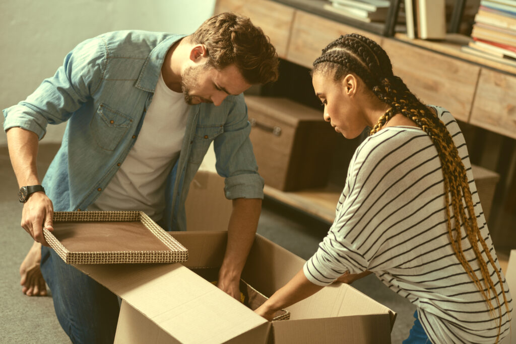 Happy Family Moving into new house with their family heirlooms