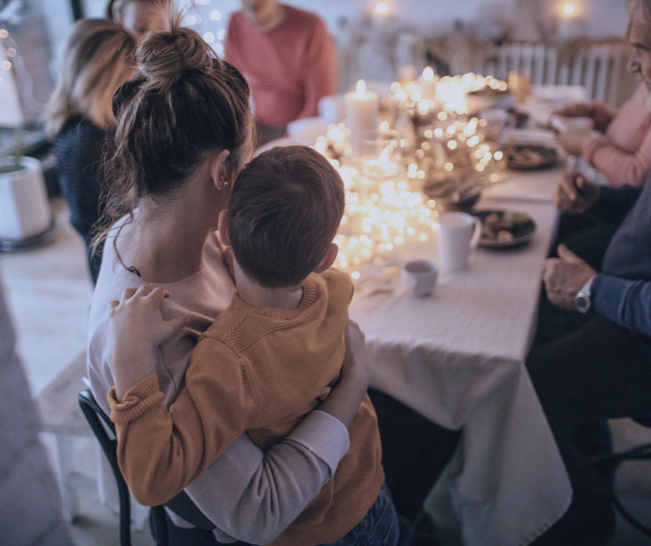 Mother holding son at Thanksgiving Dinner representing concept of questions to ask an estate planning attorney